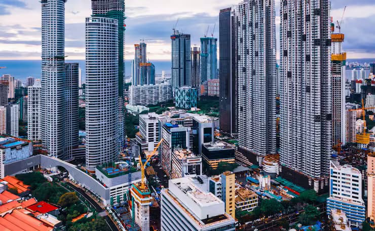 Modern commercial skyscrapers and business towers representing Business setup in India in the UAE